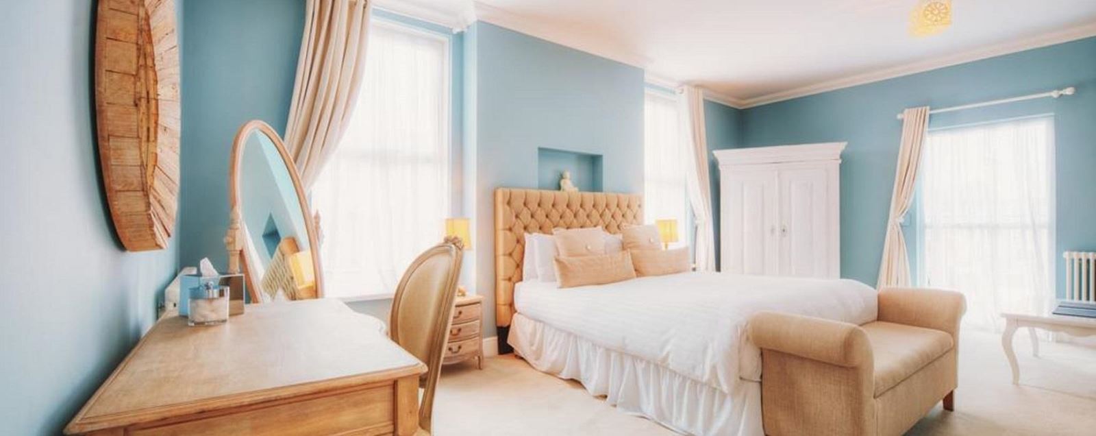 Hotel bedroom in blue and yellow decor